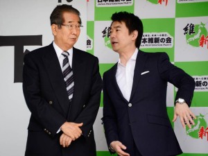 Strange bedfellows: Osaka Mayor Toru Hashimoto (right) chats to fellow co-leader of the Japan Restoration Party Shintaro Ishihara in Tokyo in June. Hashimoto announced last month that Osaka Prefecture and city will jointly submit a proposal to the Cabinet Office to set up a Special Challenge Zone where some labor protections would be relaxed or waived.